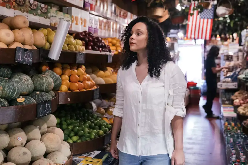 Woman looking for fruits and vegetables inside a market