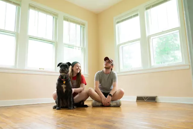 family sitting in empty house