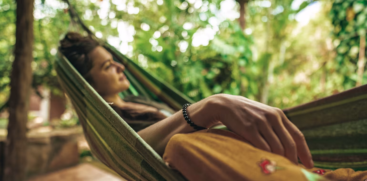 Woman relaxing in a hammock