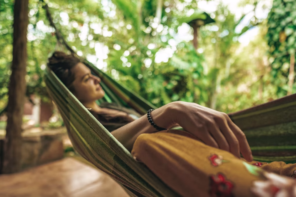 Woman relaxing in a hammock